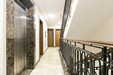 Hotel corridor interior with stairs