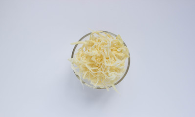 Dried squid shavings in a transparent plate on a white background © Людмила Ильина