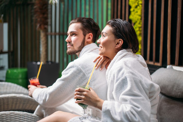 cheerful woman and man spending a good time together in the beauty salon