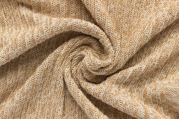 Soft home knitted plaid on white background, beige cozy fabric large knit texture