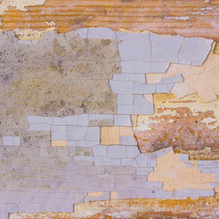 Old wooden surface with grey-blue, pale yellow shabby paint