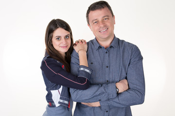 fit beauty daughter embraces the father on a white background