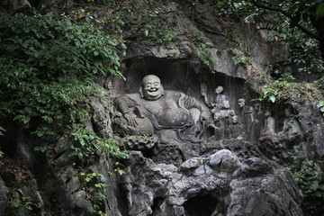 Hangzhou Happy, or Laughing, Buddha rock carving (Feilai) at Lingyin Temple (Soul's Retreat Temple) near West Lake HANGZHOU, CHINA