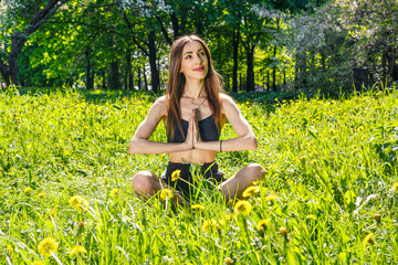 Young woman doing yoga exercises