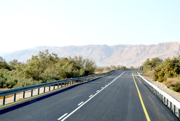 Road among beige mountains
