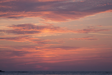 Burning cloudy sky before sunrise.