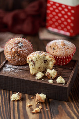 Fresh homemade delicious muffins with raisins on rustic background.  