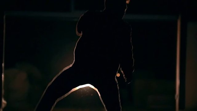 Tricks of martial arts, feilong, night against the background sparks, slow-motion