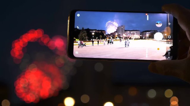 tourist filming fireworks night with the smartphone- 15 may 2018, Sofia,Bulgaria