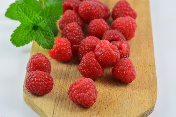 Raspberries on a wooden board