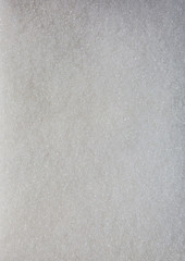 White sugar background texture. Vertical photo.