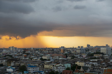 Fototapeta na wymiar Storm with beautiful sunset in the city.