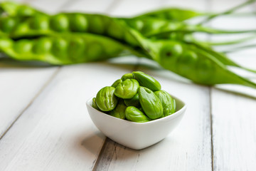 Petai, Bitter Beans on wood table, Thai vegetable food, Parkia speciosa seeds