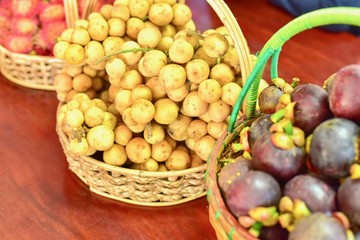 Naklejka na ściany i meble Basket Full of Tropical Fruits Consisting of Longans and Mangosteens