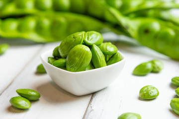 Petai, Bitter Beans on wood table, Thai vegetable food, Parkia speciosa seeds
