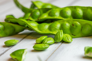 Petai, Bitter Beans on wood table, Thai vegetable food, Parkia speciosa seeds