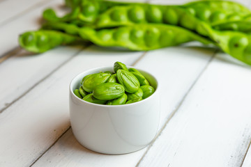Petai, Bitter Beans on wood table, Thai vegetable food, Parkia speciosa seeds