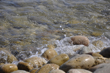 Waves crashing on the rocks on the pebble beach
