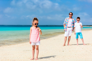 Father with kids at beach