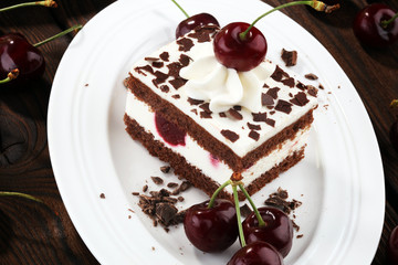 Chocolate cake with cherries and whipped cream. Black Forest cake