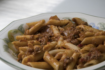 Delicious dish prepared from macaroni with tomato and meat