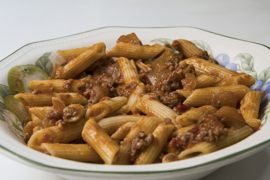 Delicious dish prepared from macaroni with tomato and meat