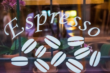 Espresso white sign on cafe window restaurant with coffee beans