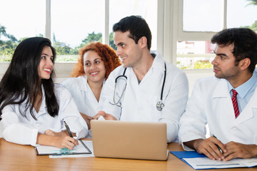 Fototapeta premium Group of caucasian doctors and nurses talking about next surgery