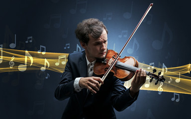 Young male musician playing on his violin with musical notes around