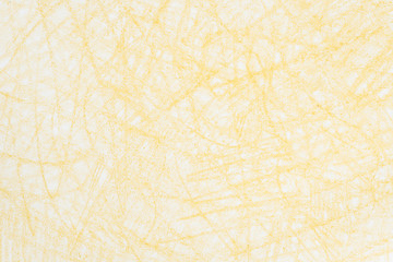 yellow crayon doodles on paper background texture