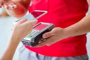 Concept of paying with POS terminal