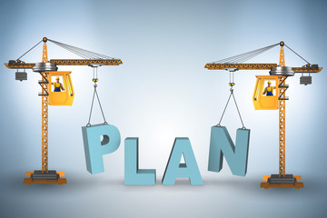 Plan and strategy concept with crane lifting letters