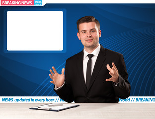 Television reporter telling breaking news at his studio desk with copy space concept
