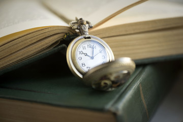 Antique Frame with old photo paper texture, Books and Pocket Clock.