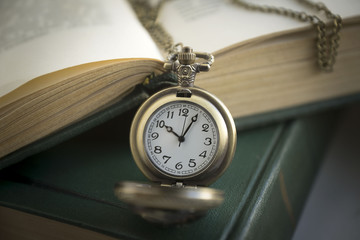 Antique Frame with old photo paper texture, Books and Pocket Clock.