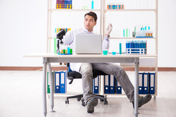 Male chemist working in lab