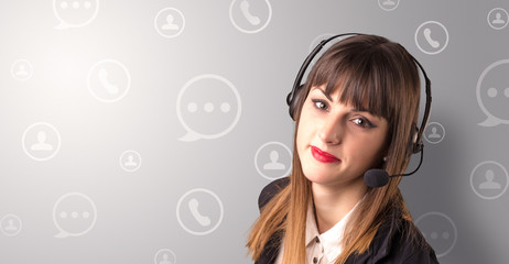 Young female telemarketer with white speech bubbles around her