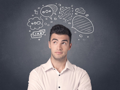 Young casual businessman with drawn speech bubbles over his head