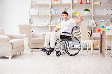 Disabled man cleaning floor at home