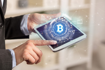 Business woman using tablet in home office mood with cryptocurrency bitcoin link network concept
