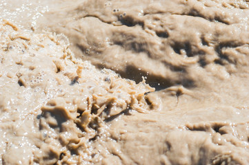 Streams and splashes of dirty water close-up background image