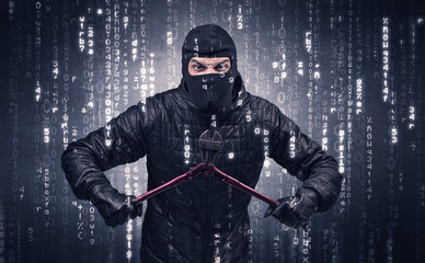 Burglar in action with encoded concept and his tools in his hand. 