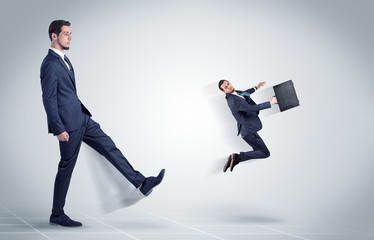 Fototapeta premium Young businessman fired cruel and aggressive by his boss with white background 