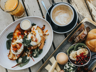 Healthy breakfast with coffee and poached eggs 