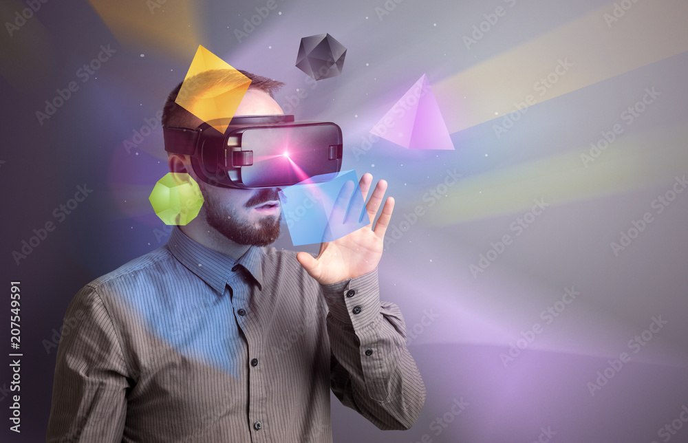 Poster amazed businessman with virtual reality colorful geometric shapes in front of him