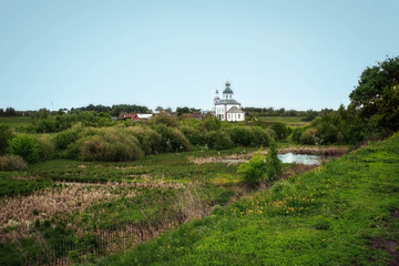 Landscape typical small orthodox church in Russian village. 