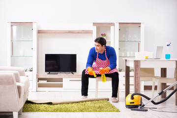 Contractor man cleaning house doing chores