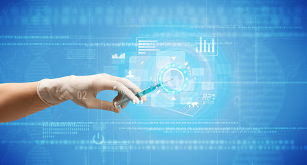 Female doctor hand holding syringe with blue background and charts