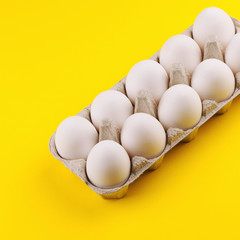 white eggs on a yellow background