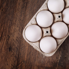white eggs on a wooden background